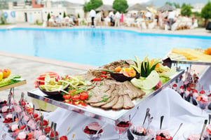 catering buffet food outdoor for wedding with meat and colorful fruits